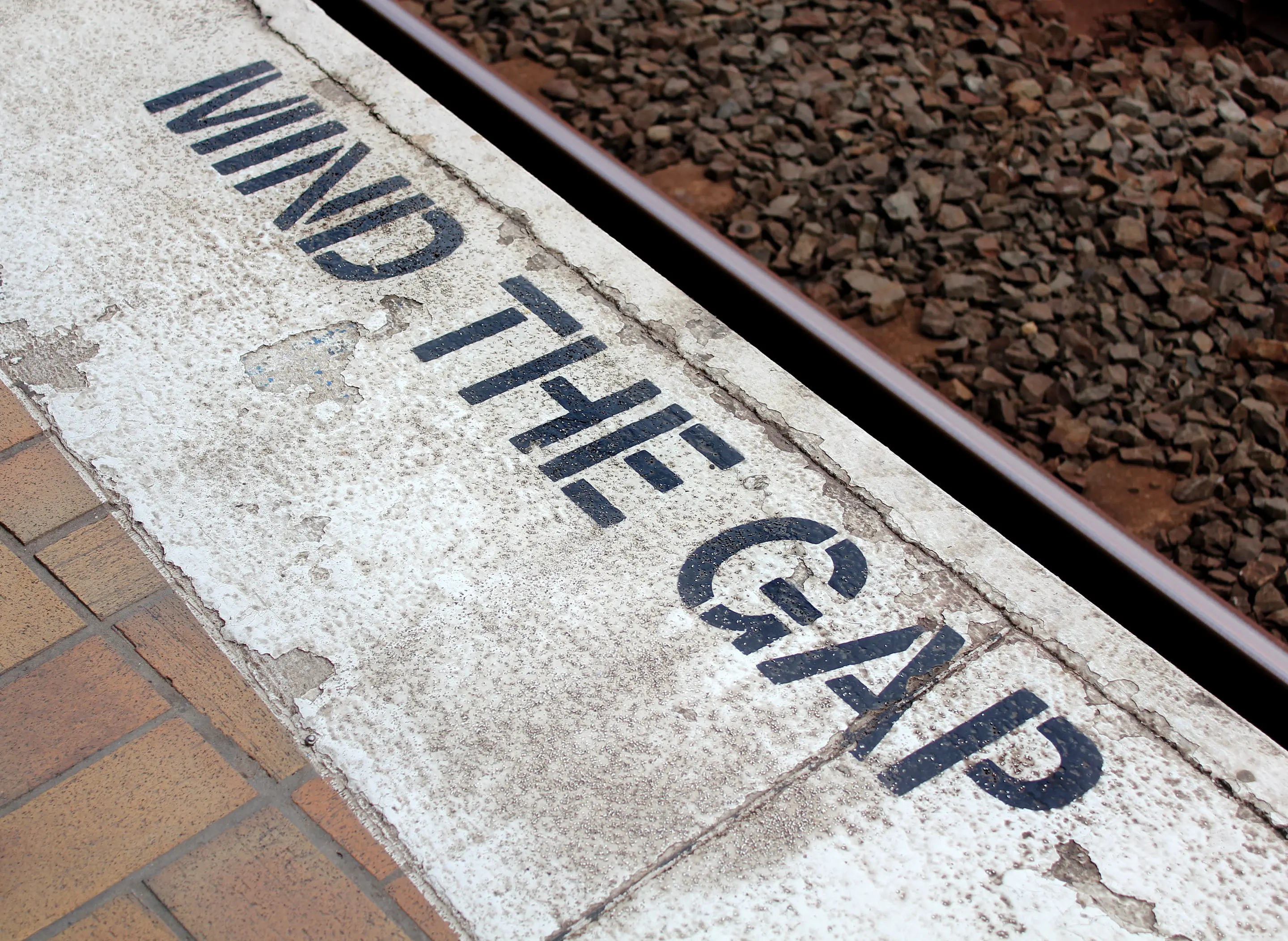 Platform with the phrase "Mind the Gap" printed on it